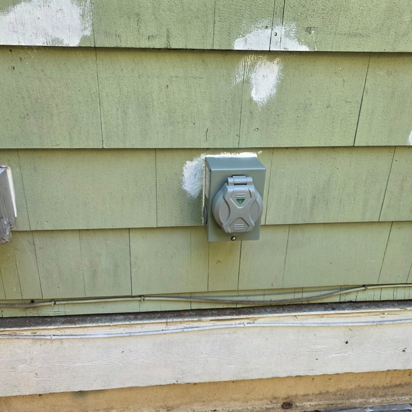 Finished 50 amp generator power inlet box mounted on exterior siding